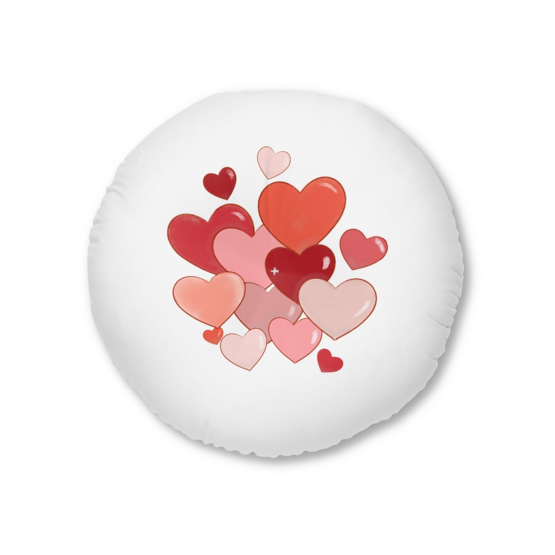 Tufted floor pillow round with heart design, white stitching, polyester filling.